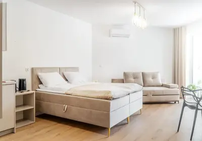 Łóżko lub łóżka w pokoju w obiekcie Lago Nysa Apartamenty nad Jeziorem Nyskim