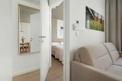 Łóżko lub łóżka w pokoju w obiekcie Księcia Witolda 60 Stylowy Apartament w Klimatycznym Budynku by Noclegi Renters