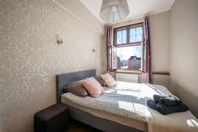 Łóżko lub łóżka w pokoju w obiekcie NiceOne Apartment Number 10 - W samym Centrum!