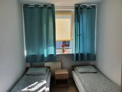 Łóżko lub łóżka w pokoju w obiekcie Hostel Berberysowa