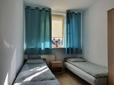 Łóżko lub łóżka w pokoju w obiekcie Hostel Berberysowa