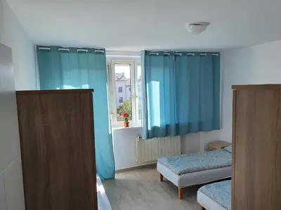 Łóżko lub łóżka w pokoju w obiekcie Hostel Berberysowa