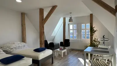 Łóżko lub łóżka w pokoju w obiekcie OPOLSKA WENECJA-apartament typu STUDIO z tarasem