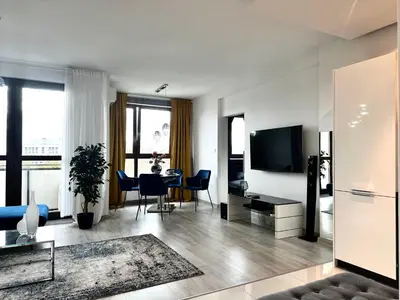 Telewizja i/lub zestaw kina domowego w obiekcie PODWALE 2 Apt 31 - Self Check-In 20h - Parking & Lift