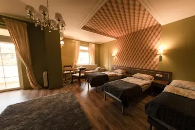 Łóżko lub łóżka w pokoju w obiekcie Hotel Granit