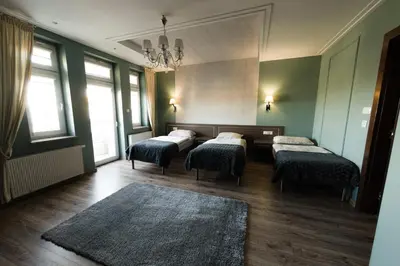 Łóżko lub łóżka w pokoju w obiekcie Hotel Granit