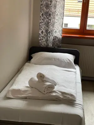 Łóżko lub łóżka w pokoju w obiekcie Lodge