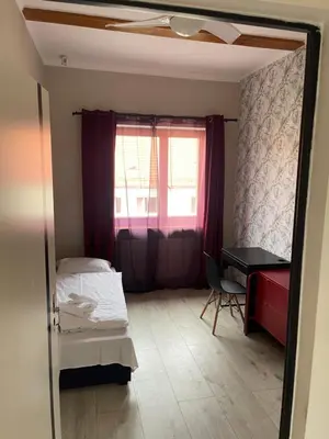 Łóżko lub łóżka w pokoju w obiekcie Lodge