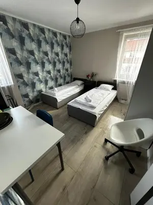 Łóżko lub łóżka w pokoju w obiekcie Lodge