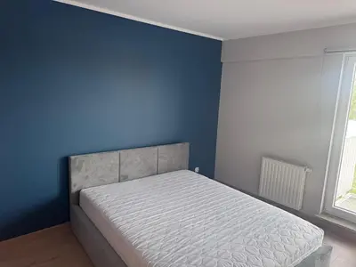 Łóżko lub łóżka w pokoju w obiekcie Kępa Mieszczańska apartment