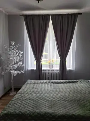 Łóżko lub łóżka w pokoju w obiekcie Apartament Świdnicka