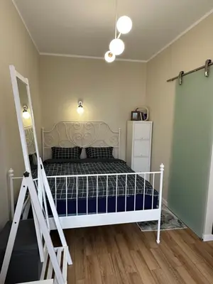 Łóżko lub łóżka w pokoju w obiekcie Apartament Piastów 12