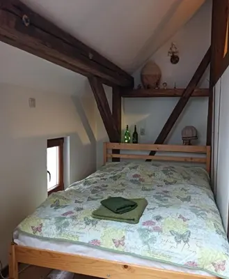 Łóżko lub łóżka w pokoju w obiekcie Dom Przytulisko