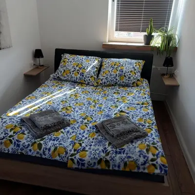 Łóżko lub łóżka w pokoju w obiekcie Apartament MiKaTy