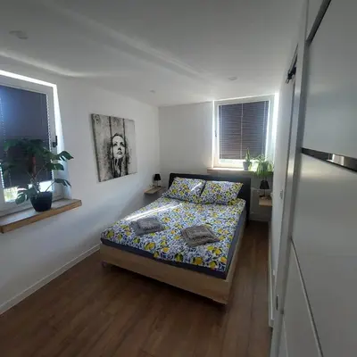 Łóżko lub łóżka w pokoju w obiekcie Apartament MiKaTy
