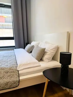 Łóżko lub łóżka w pokoju w obiekcie Justinrent PALATIUM 12