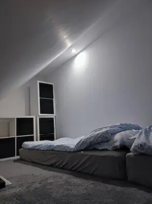 Łóżko lub łóżka w pokoju w obiekcie Ceglany Apartament Kościuszki 133