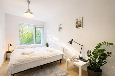 Łóżko lub łóżka w pokoju w obiekcie klimatyzowany Apartament nad Odra - Kurkowa 14 Centrum