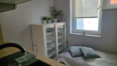 Łóżko lub łóżka w pokoju w obiekcie Mikroapartament Gamma Dyrekcyjna Wrocław