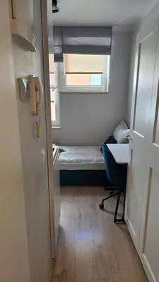 Łóżko lub łóżka w pokoju w obiekcie Mikroapartament Gamma Dyrekcyjna Wrocław