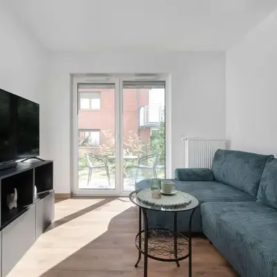 Elegant White Apartment with Terrace & Parking in Wrocław by Noclegi Renters