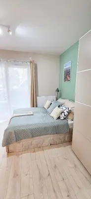 Łóżko lub łóżka w pokoju w obiekcie Fairytales Apartment Czysta III
