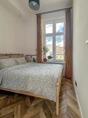 Łóżko lub łóżka w pokoju w obiekcie Apartment Kamienica Centrum
