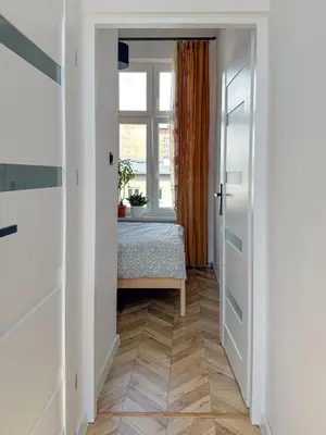 Łóżko lub łóżka w pokoju w obiekcie Apartment Kamienica Centrum