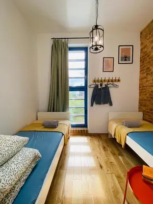 Łóżko lub łóżka w pokoju w obiekcie Wieża Ciśnień