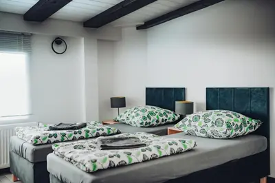 Łóżko lub łóżka w pokoju w obiekcie Orlicka Górka