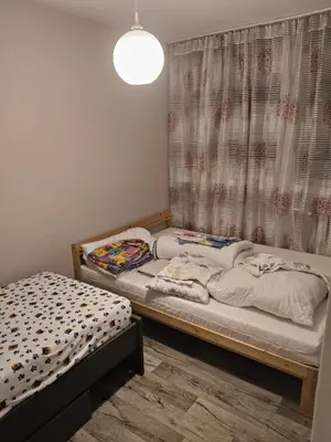 Łóżko lub łóżka w pokoju w obiekcie Wieczysta 113 Aquapark