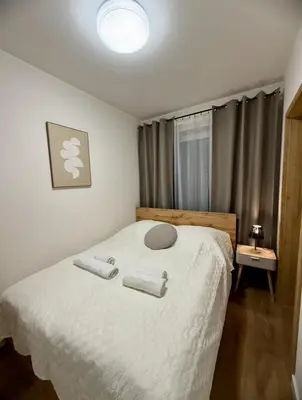 Łóżko lub łóżka w pokoju w obiekcie LOFT Apartament I Opole