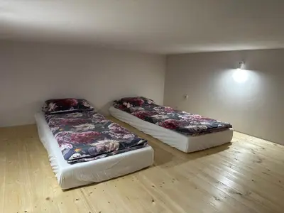 Łóżko lub łóżka w pokoju w obiekcie Wiejski Raj- Apartamenty