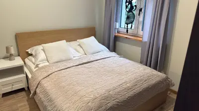 Łóżko lub łóżka w pokoju w obiekcie Jeleń Residence