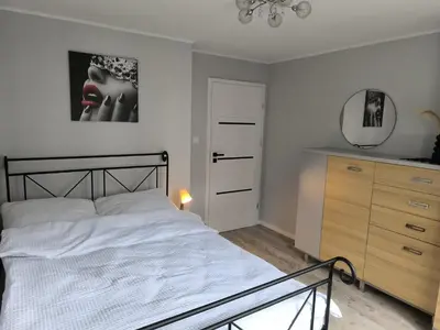 Łóżko lub łóżka w pokoju w obiekcie Belle Apartament