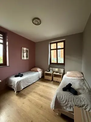 Łóżko lub łóżka w pokoju w obiekcie Cameleon