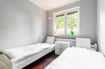 Łóżko lub łóżka w pokoju w obiekcie RentPlanet - Apartament Piękna z tarasem