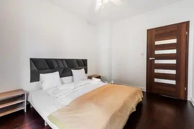 Łóżko lub łóżka w pokoju w obiekcie RentPlanet - Apartament Piękna z tarasem