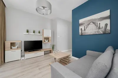 Telewizja i/lub zestaw kina domowego w obiekcie Odra Tower Apartments with FREE GARAGE Wroclaw by Noclegi Renters