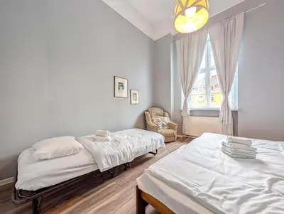 Łóżko lub łóżka w pokoju w obiekcie Wrocław Rynek Spirit Apartment by BookingHost