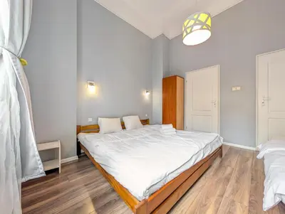 Łóżko lub łóżka w pokoju w obiekcie Wrocław Rynek Spirit Apartment by BookingHost