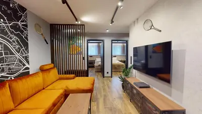 Telewizja i/lub zestaw kina domowego w obiekcie Tennis Family Lux Apartament City Center Nankiera 11