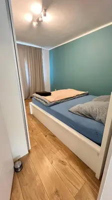 Łóżko lub łóżka w pokoju w obiekcie Apartment by Psie Pole