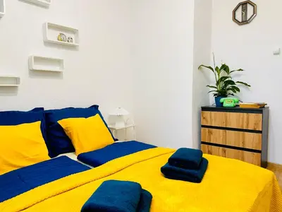 Łóżko lub łóżka w pokoju w obiekcie Perła Doliny Książa