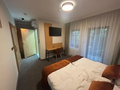Łóżko lub łóżka w pokoju w obiekcie Villa Parkova Strzelin