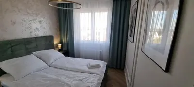 Łóżko lub łóżka w pokoju w obiekcie Prestige Apartment Oława