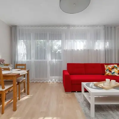 Red Apartment in Wrocław with Two Bedrooms and Desk for Remote Work by Noclegi Renters