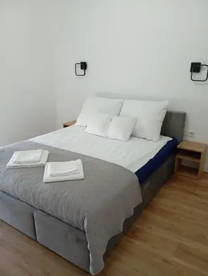 Łóżko lub łóżka w pokoju w obiekcie Dom na Rzecznej