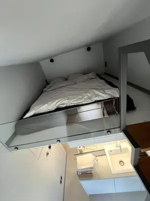 Łóżko lub łóżka w pokoju w obiekcie Mini Apartament z antresolą