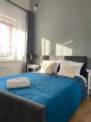 Łóżko lub łóżka w pokoju w obiekcie Apartament Rezydencja Worcella by Apartamenty na dni Wrocław